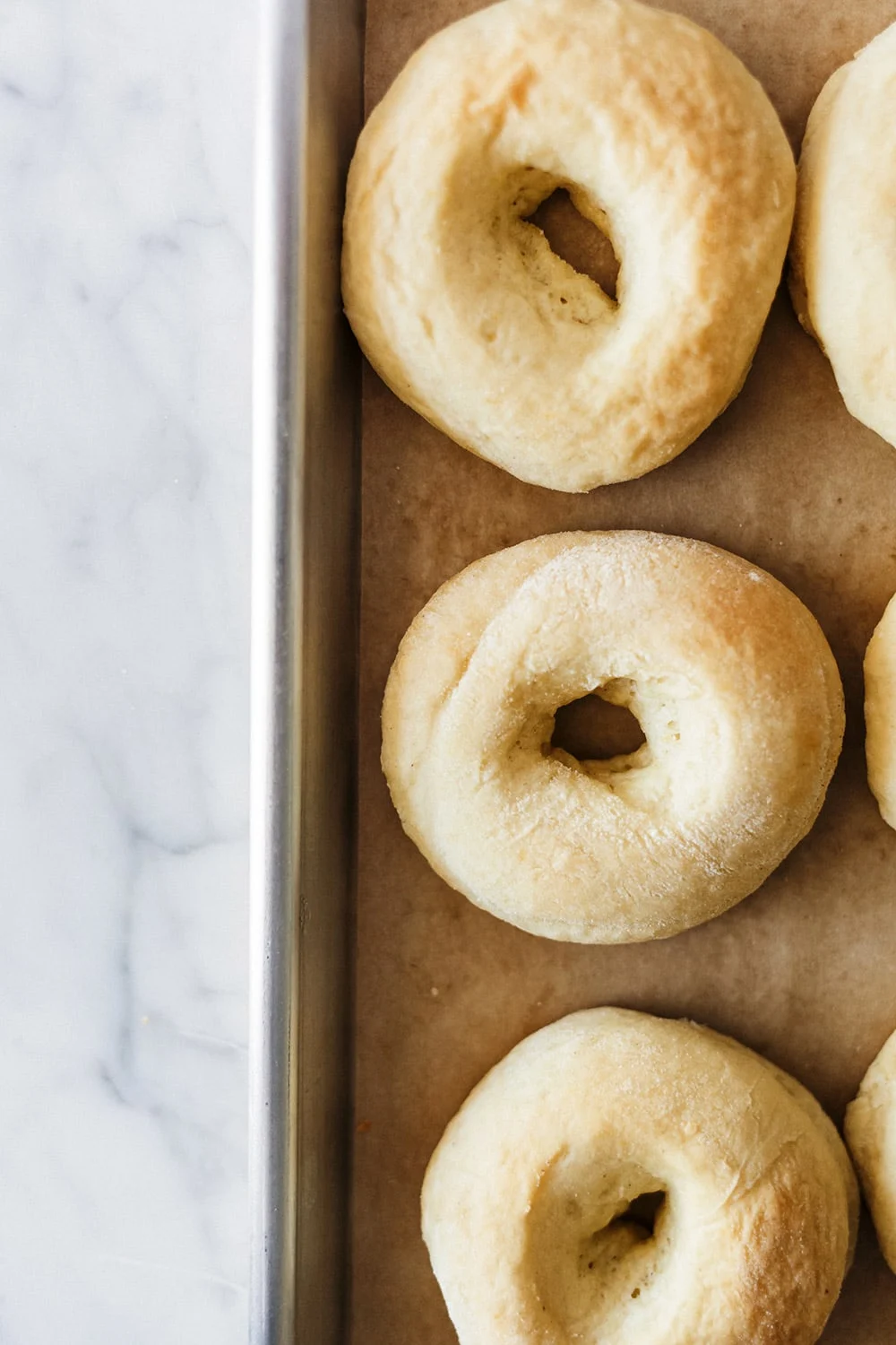 Freshly baked apple pie doughnuts dusted with cinnamon sugar, perfect for fall or dessert recipes.