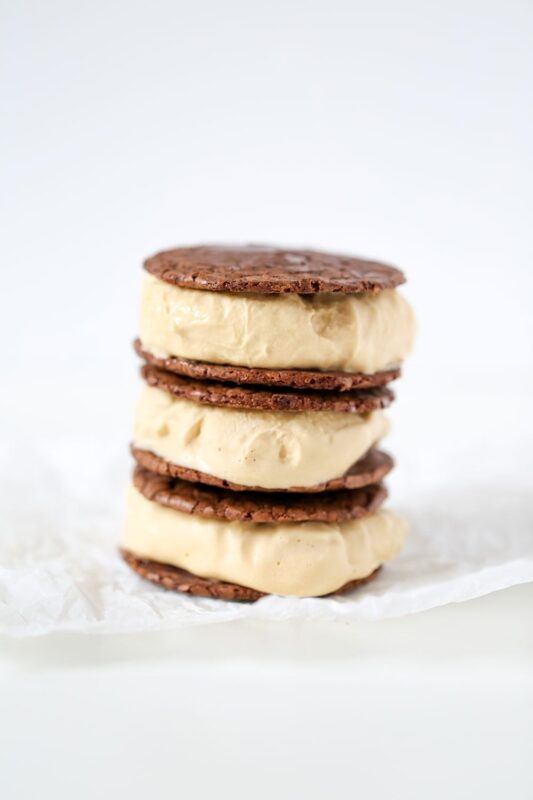 Coffee brownie ice cream sandwiches with two layers of rich, fudgy brownie cookies and a creamy cold brew coffee ice cream filling, perfect for dessert and ice cream photography.