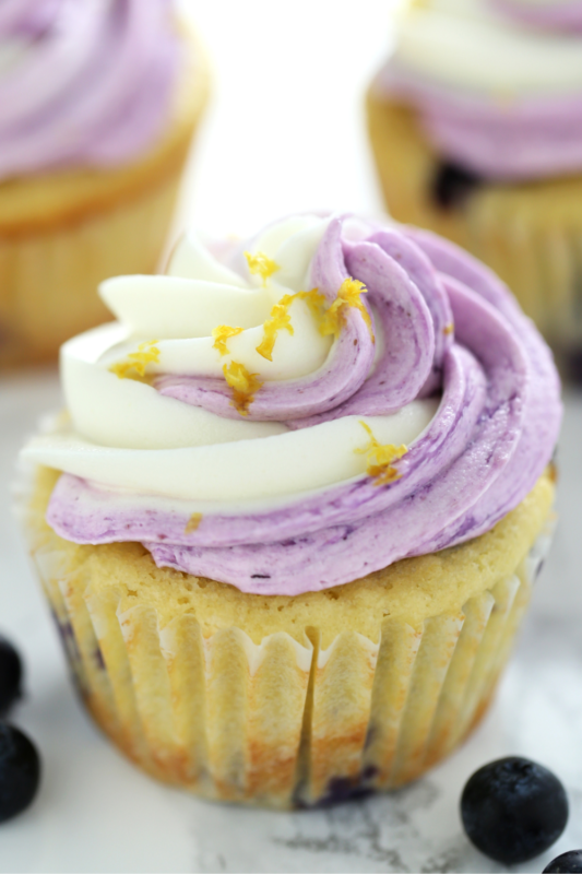 One frosted cupcake topped with fresh lemon zest, perfect for dessert and bakery photography.