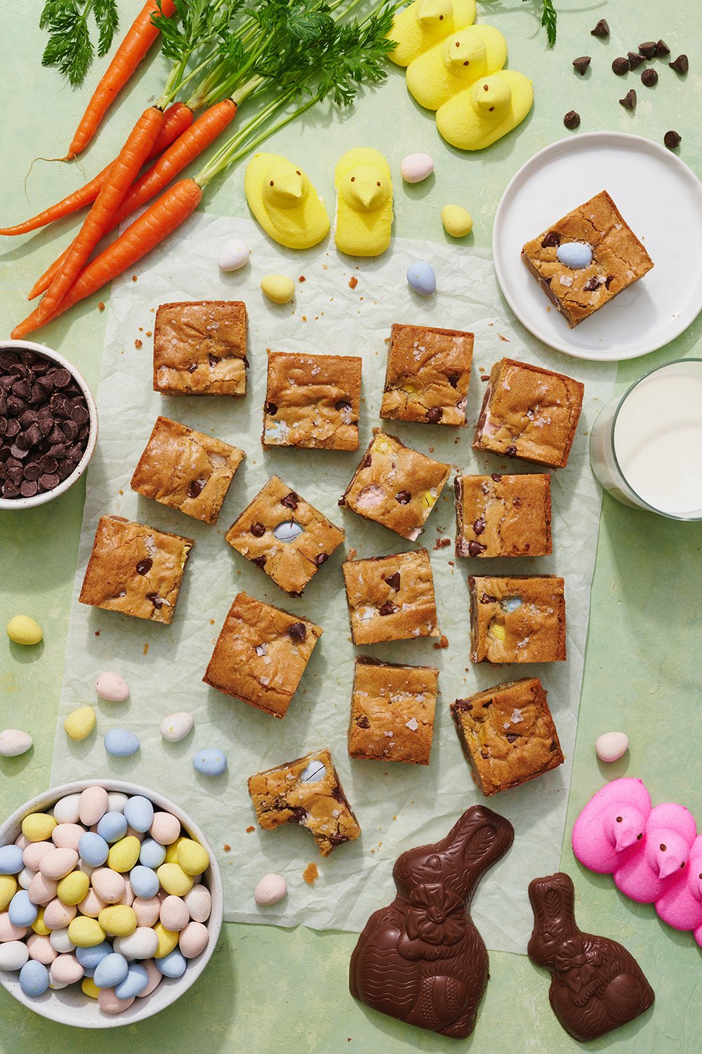 Slices of blondies surrounded by colorful Peeps and Cadbury mini eggs, perfect for Easter desserts and festive candy photography.